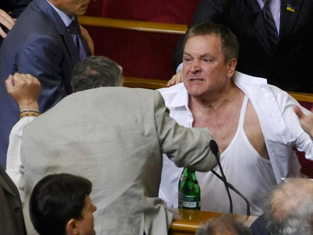 Lawmakers from pro-presidential and oppositional factions fight in the parliament session hall in Kiev, Ukraine. AP/Maks Levin