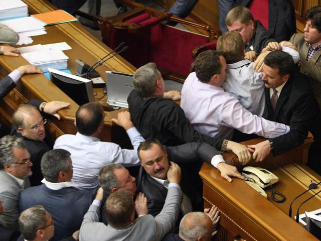 Deputies of the Ukrainian opposition fight with deputies of the pro-presidential majority during a session of parliament in Kiev, as opposition parties protest a bill proposed by the ruling party which would make Russian an official state language along with Ukrainian. AFP/Stringer