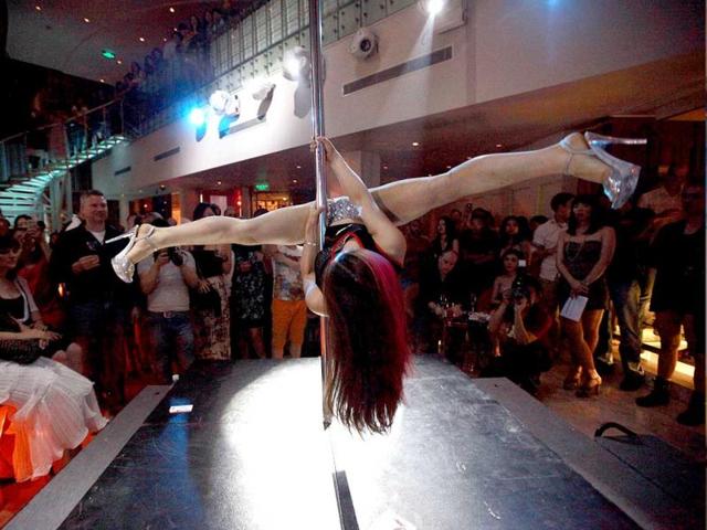 A contestant takes part in a pole dancing competition in Beijing. AP Photo/Ng Han Guan