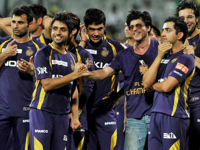 Kolkata Knight Riders owner and Bollywood actor Shah Rukh Khan celebrates with his teammates after they won the DLF IPL Twenty20 Champions Trophy in a final match against Chennai Super Kings at the MA Chidambaram Stadium in Chennai. AFP PHOTO/Manjunath KIRAN