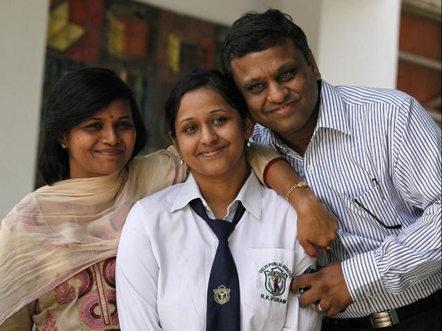 Commerce 12th class Topper Ipshita Agarwal (97.6%) along with her family celebrates her success in CBSE class XII results in New Delhi. (HT Photo/Raj K Raj)