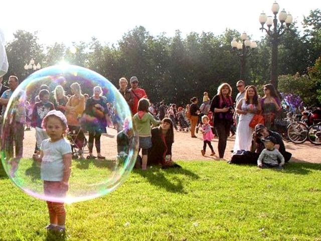 People participate soap bubble gathering in Vilnius during the "Burbuliatorius," which takes place every second Monday in summer time in more than 15 world cities. AFP/Petras Malukas