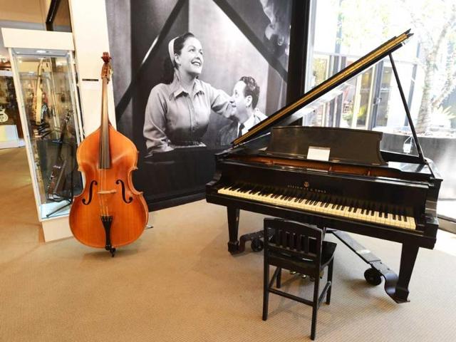 Vintage guitars owned by guitar maker Les Paul and a piano are on display during a press day at Julien's Auctions for the Estate of Les Paul auction event in Los Angeles, California. The auction includes a collection of guitars, music equipment, musical artifacts and personal effects from the legendary musician, engineer and inventor. Kevork Djansezian/Getty Images/AFP
