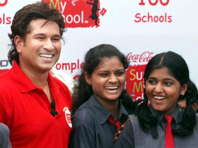 Cricketer Sachin Tendulkar with school students during an event of 'Support My School' campaign in Mumbai. PTI/Santosh Hirlekar