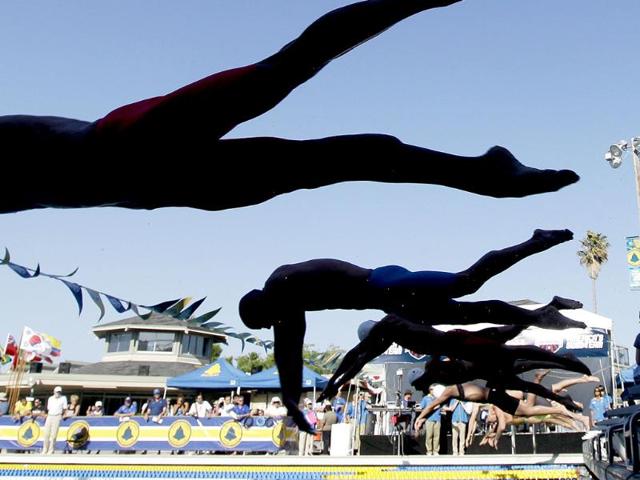 Competitors jump off the starting block in a consolation final of the men's 100-meter freestyle during the Santa Clara International Grand Prix in Santa Clara, California. AP/Marcio Jose Sanchez