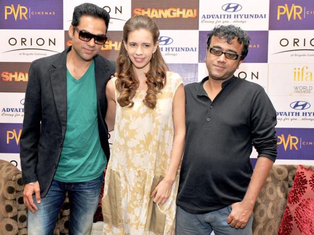 Bollywood director Dibakar Banerjee, actress Kalki Koechlin and actor Abha Deol pose for a pic at a promotional event of their upcoming movie Shanghai. (AFP)
