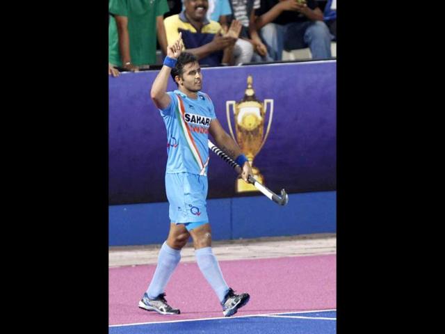 Tushar Khandker celebrates after he scored third goal for India during 3rd place palyoff against Britain at the Sultan Azlan Shah Cup men's field hockey tournament in Ipoh, Malaysia. India won the match 3-1. (AP Photo)