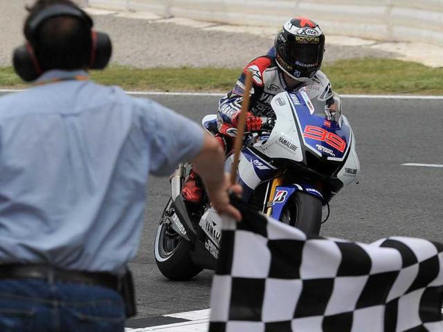 Yamaha Factory Racing's Spanish Jorge Lorenzo crosses the finish line of the MotoGP race of the Catalunya Moto GP at the Catalunya racetrack in Montmelo, near Barcelona. AFP/Lluis Gene