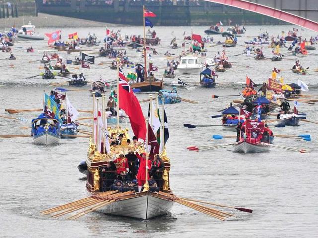 The Gloriana is seen leading the flotilla during the Thames Diamond Jubilee River Pageant in London, Sunday, June 3, 2012. More than 1,000 boats were to sail down the Thames on Sunday in a flotilla tribute to Queen Elizabeth II's 60 years on the throne that organizers are calling the biggest gathering on the river for 350 years. Despite cool, drizzly weather, hundreds of thousands of people are expected to line the riverbanks in London, feting the British monarch whose longevity has given her the status of the nation's favorite grandmother. (AP Photo/Tim Hales)