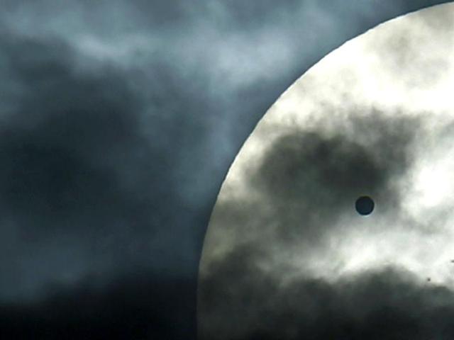 The planet Venus can be seen on its transit of the Sun, from New Delhi. Reuters Photo/Adnan Abidi