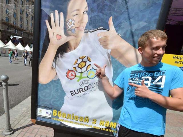 A football fan poses in the Euro 2012 fanzone in Kiev. AFP/Sergei Supinsky