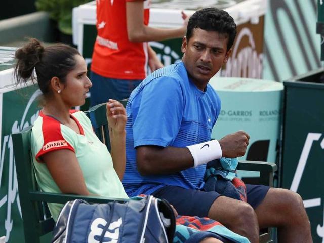 Sania Mirza and Mahesh Bhupathi (R) talk during a game break as they play against Poland's Klaudia Jans-Ignacik and Mexico's Santiago Gonzalez during their mixed doubles final match of the French Open tennis tournament. AFP/Kenzo Tribouillard