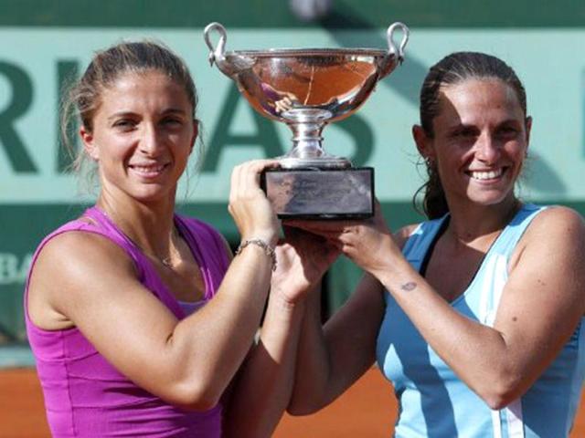 Italy's Sara Errani (R) and Italy's Roberta Vinci pose with a throphy after winning over Russia's Maria Kirilenko and Russia's Nadia Petrova during their Women's Doubles final tennis match of the French Open tennis tournament at the Roland Garros stadium in Paris. (AFP photo/Thomas Coex) Italy's Sara Errani (R) and Italy's Roberta Vinci pose with a throphy after winning over Russia's Maria Kirilenko and Russia's Nadia Petrova during their Women's Doubles final tennis match of the French Open tennis tournament at the Roland Garros stadium in Paris. (AFP photo/Thomas Coex)