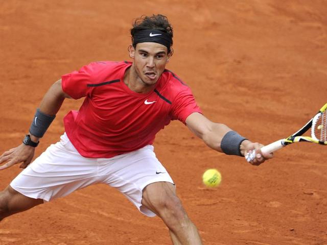 Spain's Rafael Nadal hits a return to Serbia's Novak Djokovic during their Men's Singles final tennis match of the French Open tennis tournament at the Roland Garros stadium, in Paris.AFP Photo/Pascal Guyot