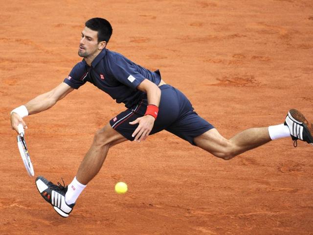 Serbia's Novak Djokovic hits a return to Spain's Rafael Nadal during their Men's Singles final tennis match of the French Open tennis tournament at the Roland Garros stadium, in Paris. AFP Photo/Pascal Guyot