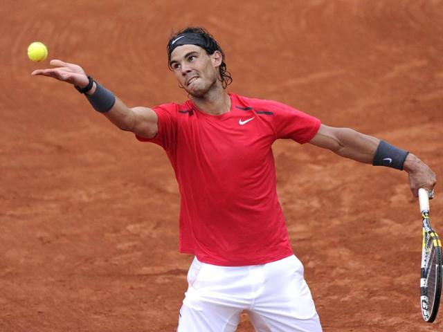 Spain's Rafael Nadal hits a return to Serbia's Novak Djokovic during their Men's Singles final tennis match of the French Open tennis tournament at the Roland Garros stadium, in Paris. AFP Photo/Pascal Guyot