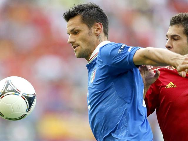 Italy's Cristian Maggio, left, takes the ball away from Spain's Jordi Alba during the Euro 2012 soccer championship Group C match between Spain and Italy in Gdansk, Poland. AP/Gregorio Borgia