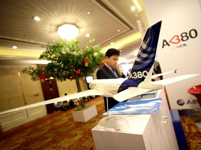 A delegate gets information from an Airbus booth during the 68th International Air Transport Association (IATA) annual general meeting in Beijing. Reuters/Jason Lee