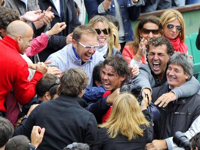 Spain's Rafael Nadal celebrates with his sister his staff members and his family after winning against Serbia's Novak Djokovic their Men's Singles final tennis match of the French Open tennis tournament at the Roland Garros stadium in Paris. (AFP photo/Pacal Guyot) Spain's Rafael Nadal celebrates with his sister his staff members and his family after winning against Serbia's Novak Djokovic their Men's Singles final tennis match of the French Open tennis tournament at the Roland Garros stadium in Paris. (AFP photo/Pacal Guyot)
