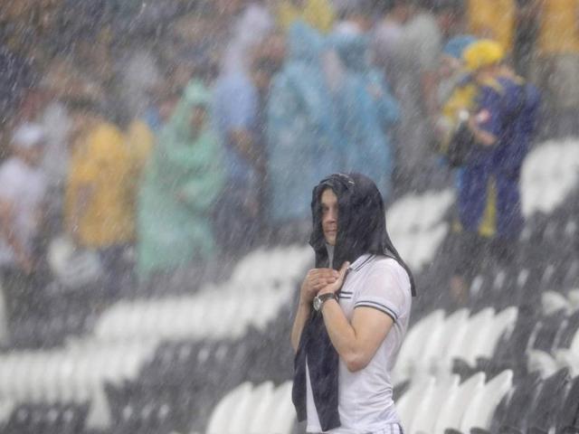 A man shelters himself during a heavy rain at Donbass Arena after the Group D Euro 2012 soccer match between Ukraine and France was suspended in Donetsk. Reuters/Alessandro Bianchi A man shelters himself during a heavy rain at Donbass Arena after the Group D Euro 2012 soccer match between Ukraine and France was suspended in Donetsk. Reuters/Alessandro Bianchi