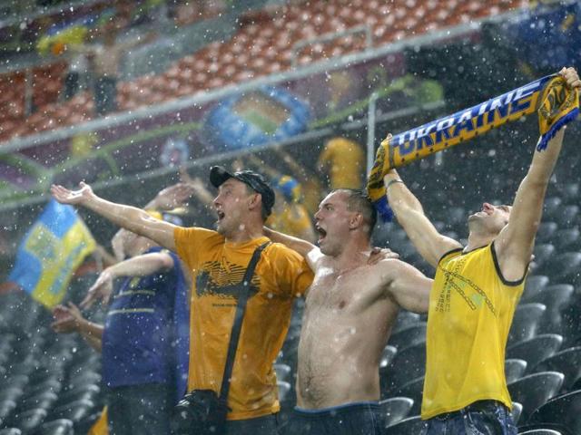 Fans of Ukraine react during a heavy rain as their Group D Euro 2012 soccer match against France was suspended at Donbass Arena in Donetsk. Reuters/Alessandro Bianchi Fans of Ukraine react during a heavy rain as their Group D Euro 2012 soccer match against France was suspended at Donbass Arena in Donetsk. Reuters/Alessandro Bianchi