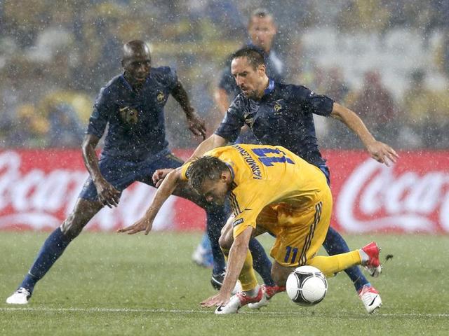 Ukraine's Andriy Yarmolenko (front) falls down as he is challenged by France's Franck Ribery (R) during their Group D Euro 2012 soccer match in Donetsk. Reuters/Yves Herman Ukraine's Andriy Yarmolenko (front) falls down as he is challenged by France's Franck Ribery (R) during their Group D Euro 2012 soccer match in Donetsk. Reuters/Yves Herman