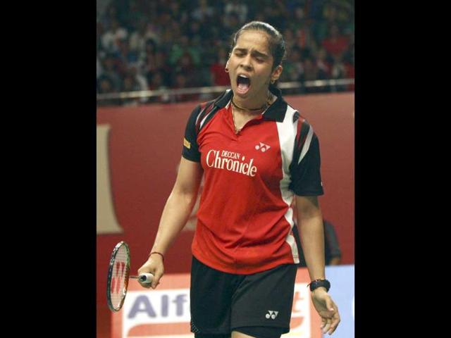 Saina Nehwal reacts after scoring a point against China's Li Xuerui during their women's singles final match at Djarum Indonesia Open badminton tournament in Jakarta. AP/Achmad Ibrahim