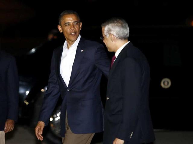 US President Barack Obama (L) is greeted by Mexico's Undersecretary for North America Julian Ventura upon Obama's arrival in Los Cabos. Reuters/Jason Reed