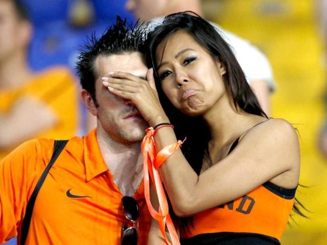 Netherlands' fans react at the end of their Group B Euro 2012 soccer match against Germany at the Metalist stadium in Kharkiv. (Reuters/Alessandro Bianchi)