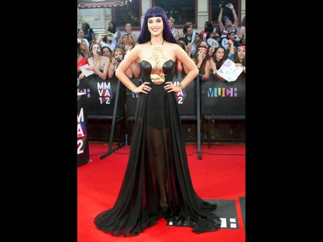Katy Perry flaunts a Greek look in a black floor-length gown. (AP photo)