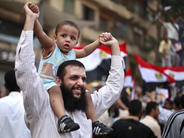 Supporters of the Muslim Brotherhood's presidential candidate Mohamed Morsy celebrate at Tahrir square in Cairo. Reuters/Suhaib Salem