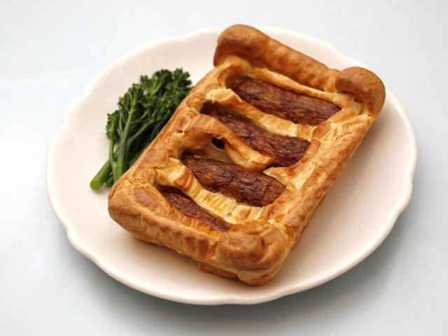 A traditional British dish of sausages baked in batter, called 'Toad in the Hole' is photographed in London. A menu of oddly named and sometimes oddly tasting traditional British dishes awaits adventurous diners visiting London for the Olympic Games this summer. REUTERS/Suzanne Plunkett
