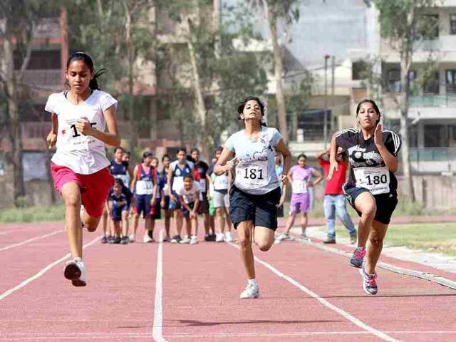 Aspirant students running a 50m dash during the Fitness trail test for admission at Shri Ram College of Commerce in New Delhi. HT/M Zhazo
