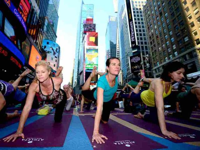 Participants take part in a mass yoga class to mark the summer solstice on Times Square in New York. (AFP photo/Emmanuel Dunand)
