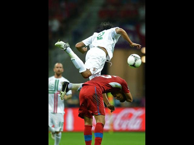Czech forward Milan Baros (down) vies with Portuguese defender Bruno Alves during the Euro 2012 football championships quarter-final match the Czech Republic vs Portugal at the National Stadium in Warsaw. AFP/Francisco Leong Czech forward Milan Baros (down) vies with Portuguese defender Bruno Alves during the Euro 2012 football championships quarter-final match the Czech Republic vs Portugal at the National Stadium in Warsaw. AFP/Francisco Leong