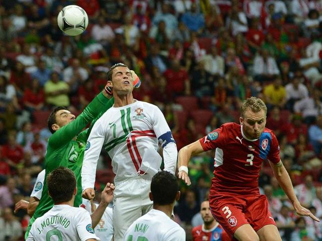Portuguese forward Cristiano Ronaldo (C) and Portuguese goalkeeper Rui Patricio (L) jump to deflect the ball during the Euro 2012 football championships quarter-final match the Czech Republic vs Portugal at the National Stadium in Warsaw. AFP/Anne-Christine Poujoulat Portuguese forward Cristiano Ronaldo (C) and Portuguese goalkeeper Rui Patricio (L) jump to deflect the ball during the Euro 2012 football championships quarter-final match the Czech Republic vs Portugal at the National Stadium in Warsaw. AFP/Anne-Christine Poujoulat