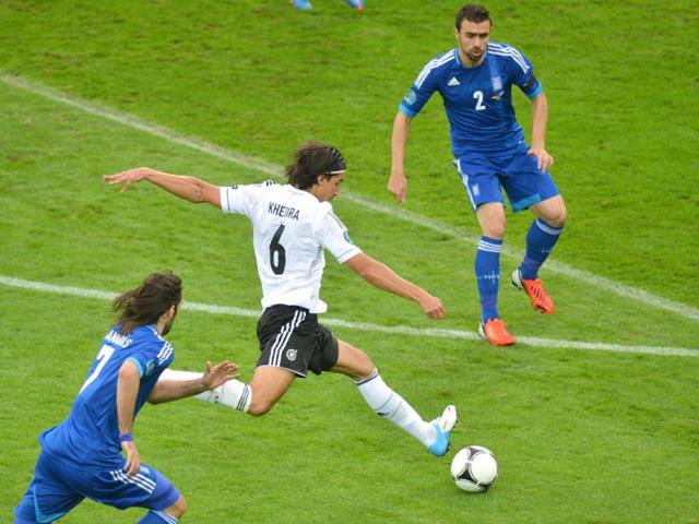 German midfielder Sami Khedira shoots the ball during the Euro 2012 football championships quarter-final match Germany vs Greece at the Gdansk Arena. (AFP photo/Gabriel Bouys)