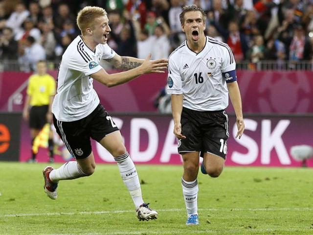 Germany's Philipp Lahm celebrates with Marco Reus, after scoring during the Euro 2012 soccer championship quarterfinal match between Germany and Greece in Gdansk, Poland. AP/Frank Augstein
