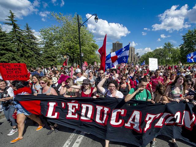 Students protest a hike in tuition fees in Montreal, Canada. After two weeks of relative calm, tens of thousands of students were back on the streets to protest the rising university fees, now in its fifth month. AFP/Rogerio Barbosa