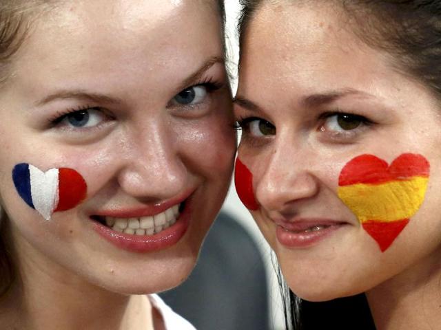 Soccer fans wait for the start of the Euro 2012 quarter-final soccer match between Spain and France at the Donbass Arena in Donetsk. Reuters/Alessandro Bianchi