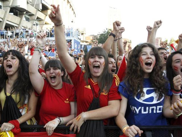 Supporters celebrate Spain's win against France during their Euro 2012 quarter-final soccer match at a fan mile in Madrid. Reuters/Andrea Comas