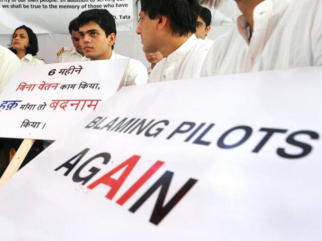 Striking-Air-India-pilots-hold-placards-during-a-hunger-strike-in-New-Delhi-AFP-Photo-Sajjad-Hussain Striking-Air-India-pilots-hold-placards-during-a-hunger-strike-in-New-Delhi-AFP-Photo-Sajjad-Hussain