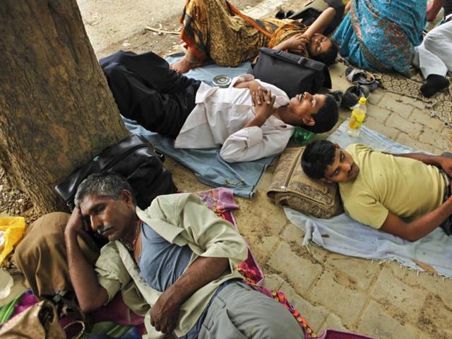 Villagers sleep in the shade of a tree on a hot summer day in Allahabad. AP/Rajesh Kumar Singh