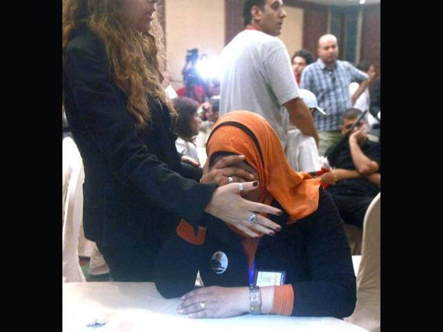 Supporters of presidential candidate Ahmed Shafik react after hearing the results of the presidential elections in Cairo. (Reuters/Asmaa Waguih)