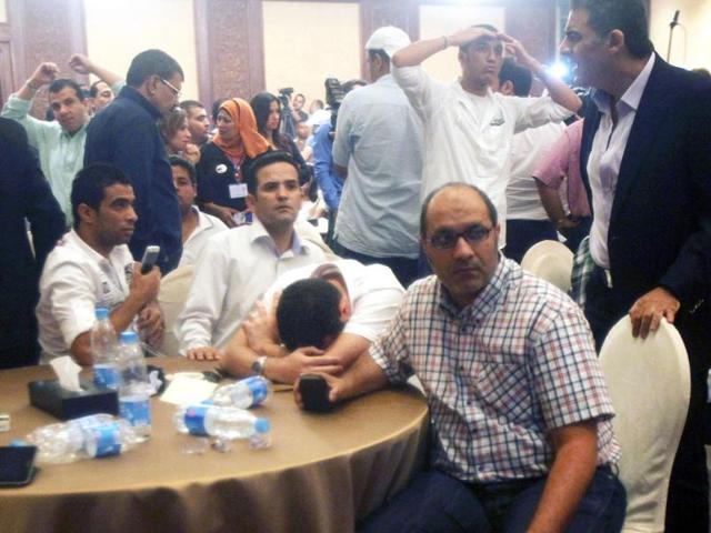 Supporters of presidential candidate Ahmed Shafik react after hearing the results of the presidential elections in Cairo. (Reuters/Asmaa Waguih)