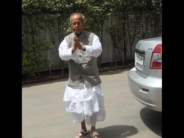 Union finance minister and UPA Presidential nominee Pranab Mukherjee arrive to attend the Congress Working Committee (CWC) meeting at Sonia Gandhi's residence, in New Delhi. Congress party's highest decision making body- Congress Working Committee (CWC) met to discuss the forthcoming Presidential polls. Finance minister Pranab Mukherjee, who is the UPA candidate for the President's post, is the longest serving member of the CWC and was given farewell during the CWC meeting. (Photo By Sonu Mehta/Hindustan Times)