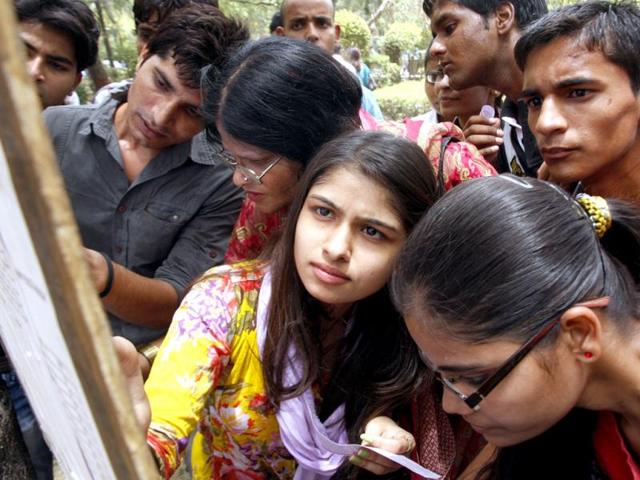 Students checking the list of candidates recommended for admission in Delhi University. HT photo/M Zhazo