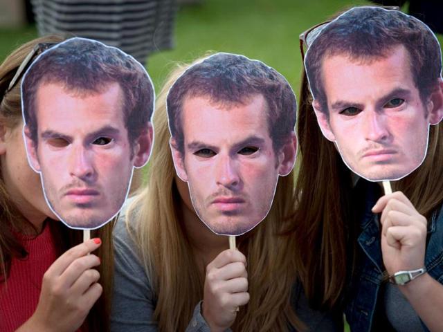 Tennis fans pose for pictures with masks of British tennis player Andy Murray as they queue for tournament tickets to watch the action on the second day of the 2012 Wimbledon Championships tennis tournament at the All England Tennis Club in Wimbledon, southwest London. (AFP Photo) Tennis fans pose for pictures with masks of British tennis player Andy Murray as they queue for tournament tickets to watch the action on the second day of the 2012 Wimbledon Championships tennis tournament at the All England Tennis Club in Wimbledon, southwest London. (AFP Photo)