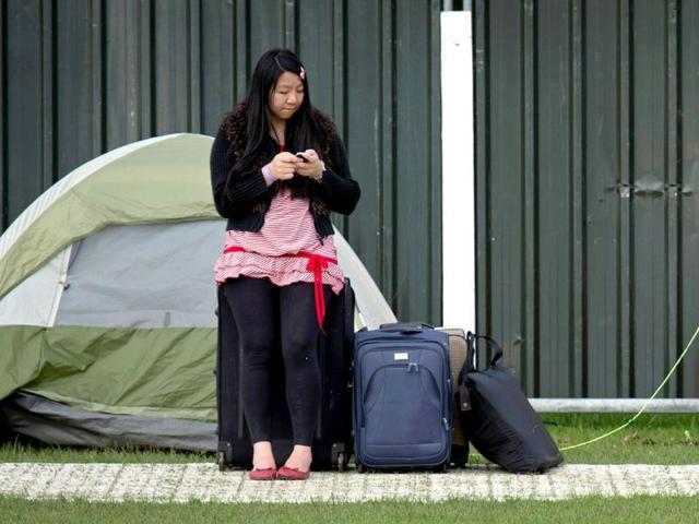 A tennis fan stands beside her tent as she queues for tickets to watch the action on the second day of the 2012 Wimbledon Championships tennis tournament at the All England Tennis Club in Wimbledon, southwest London. (AFP Photo) A tennis fan stands beside her tent as she queues for tickets to watch the action on the second day of the 2012 Wimbledon Championships tennis tournament at the All England Tennis Club in Wimbledon, southwest London. (AFP Photo)