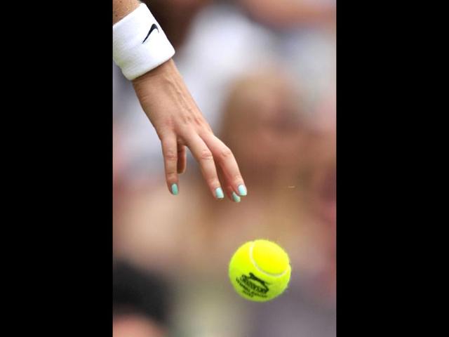 Close up of the hand of Czech Republic's Petra Kvitova bouncing the ball during her first round women's singles match against Uzbekistan's Akgul Amanmuradova on the second day of the 2012 Wimbledon Championships tennis tournament at the All England Tennis Club in Wimbledon, southwest London. (AFP Photo) Close up of the hand of Czech Republic's Petra Kvitova bouncing the ball during her first round women's singles match against Uzbekistan's Akgul Amanmuradova on the second day of the 2012 Wimbledon Championships tennis tournament at the All England Tennis Club in Wimbledon, southwest London. (AFP Photo)